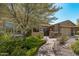 Single-story home with landscaped yard and walkway at 18111 W Desert Sage Dr, Goodyear, AZ 85338