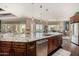 Island kitchen with granite countertops, stainless steel appliances, and views at 18111 W Desert Sage Dr, Goodyear, AZ 85338