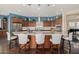 Spacious kitchen with granite countertops, custom cabinetry, and breakfast bar at 18111 W Desert Sage Dr, Goodyear, AZ 85338