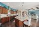 Gourmet kitchen with granite countertops, stainless steel appliances, and a large island at 18111 W Desert Sage Dr, Goodyear, AZ 85338