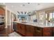 Modern kitchen featuring granite island, stainless steel appliances, and open layout at 18111 W Desert Sage Dr, Goodyear, AZ 85338