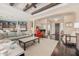 Living area with hardwood floors, exposed beams, and comfy seating at 18111 W Desert Sage Dr, Goodyear, AZ 85338