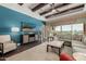 Bright living room featuring hardwood floors, large windows, and comfortable seating at 18111 W Desert Sage Dr, Goodyear, AZ 85338