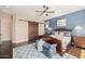 Main bedroom with dark wood floors and a view to the backyard at 18111 W Desert Sage Dr, Goodyear, AZ 85338