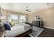 Main bedroom with dark wood floors and a view to the backyard at 18111 W Desert Sage Dr, Goodyear, AZ 85338