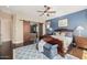 Main bedroom with dark wood floors and a view to the backyard at 18111 W Desert Sage Dr, Goodyear, AZ 85338