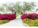 Inviting park entrance with vibrant bougainvillea and a wrought-iron gate at 18111 W Desert Sage Dr, Goodyear, AZ 85338
