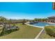 Inviting pool and spa area with lush lawn and comfortable lounge chairs at 18111 W Desert Sage Dr, Goodyear, AZ 85338