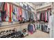 Large walk-in closet with ample shelving and hanging space at 18111 W Desert Sage Dr, Goodyear, AZ 85338