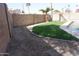 Manicured backyard with rock area and lush green space provides a serene escape at 18429 N 16Th Way, Phoenix, AZ 85022