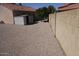 Low maintenance backyard with desert landscaping and storage shed at 18429 N 16Th Way, Phoenix, AZ 85022