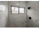 Clean bathroom with walk-in shower and window for natural light at 18429 N 16Th Way, Phoenix, AZ 85022