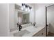 Modern bathroom with double vanity and black fixtures at 18429 N 16Th Way, Phoenix, AZ 85022