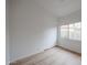 Bright bedroom with wood-look floors and sliding closet doors at 18429 N 16Th Way, Phoenix, AZ 85022