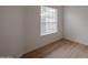 Simple bedroom with wood-look floors and window blinds at 18429 N 16Th Way, Phoenix, AZ 85022
