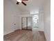 Bright bedroom with mirrored closet doors and ensuite bathroom at 18429 N 16Th Way, Phoenix, AZ 85022