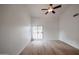 Bright bedroom with wood floors and private balcony access at 18429 N 16Th Way, Phoenix, AZ 85022