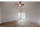 Spacious bedroom with light wood floors and ceiling fan at 18429 N 16Th Way, Phoenix, AZ 85022