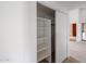 White built-in shelving in spacious closet at 18429 N 16Th Way, Phoenix, AZ 85022