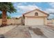 Tan stucco house with a two-car garage and desert landscaping at 18429 N 16Th Way, Phoenix, AZ 85022