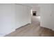 Bright hallway with light wood floors leading to living room and other rooms at 18429 N 16Th Way, Phoenix, AZ 85022