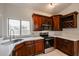 Modern kitchen with dark wood cabinets and quartz countertops at 18429 N 16Th Way, Phoenix, AZ 85022