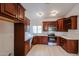 Modern kitchen, featuring dark wood cabinets and stainless steel appliances at 18429 N 16Th Way, Phoenix, AZ 85022