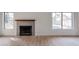 Living area featuring a fireplace and backyard access at 18429 N 16Th Way, Phoenix, AZ 85022