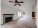 Bright living room with fireplace and wood-look floors at 18429 N 16Th Way, Phoenix, AZ 85022