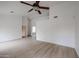 Living room with ceiling fan and fireplace at 18429 N 16Th Way, Phoenix, AZ 85022