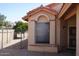 Close-up of an exterior window with brick trim and desert landscaping at 18429 N 16Th Way, Phoenix, AZ 85022