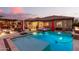 Stunning backyard with a sparkling pool, spa, and fire pit perfect for entertaining at 19000 E Old Beau Trl, Queen Creek, AZ 85142