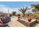 Relaxing backyard with pool, fire pit, and water feature at 19000 E Old Beau Trl, Queen Creek, AZ 85142