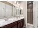 Bathroom with double vanity and a shower at 19000 E Old Beau Trl, Queen Creek, AZ 85142
