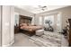 Spacious main bedroom with a large bed, exercise equipment, and plenty of natural light at 19000 E Old Beau Trl, Queen Creek, AZ 85142
