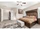 Bright bedroom with a king-size bed and access to the bathroom at 19000 E Old Beau Trl, Queen Creek, AZ 85142