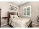 Cozy bedroom with wood furniture and window shutters at 19000 E Old Beau Trl, Queen Creek, AZ 85142