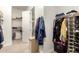 Large walk-in closet with ample shelving and hanging space at 19000 E Old Beau Trl, Queen Creek, AZ 85142