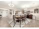 Formal dining room with a large table and chairs, and access to the entryway at 19000 E Old Beau Trl, Queen Creek, AZ 85142
