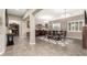 Elegant dining room featuring a large table, chandelier, and hardwood floors at 19000 E Old Beau Trl, Queen Creek, AZ 85142