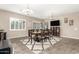 Spacious dining area with a large table, chandelier, and views to the living room at 19000 E Old Beau Trl, Queen Creek, AZ 85142