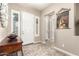 Bright entryway with a console table and neutral color palette at 19000 E Old Beau Trl, Queen Creek, AZ 85142