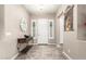 Bright entryway with a console table and neutral color palette at 19000 E Old Beau Trl, Queen Creek, AZ 85142