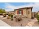 House exterior with red shutters and a rock pathway at 19000 E Old Beau Trl, Queen Creek, AZ 85142