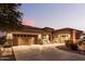 Spacious home with a three-car garage and inviting front entrance at 19000 E Old Beau Trl, Queen Creek, AZ 85142