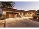 Charming home with a three-car garage and inviting front porch at 19000 E Old Beau Trl, Queen Creek, AZ 85142