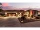 Lovely home with a three-car garage and nicely landscaped front yard at 19000 E Old Beau Trl, Queen Creek, AZ 85142