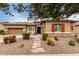 Beautiful one-story home with a two-car garage and landscaped yard at 19000 E Old Beau Trl, Queen Creek, AZ 85142