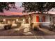 Stunning one-story home with a three-car garage and landscaped front yard at 19000 E Old Beau Trl, Queen Creek, AZ 85142