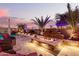 Relaxing patio with fire pit, water feature, and comfortable seating at 19000 E Old Beau Trl, Queen Creek, AZ 85142